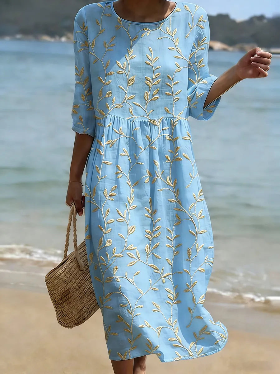 Abito blu ricamato con fiori vintage